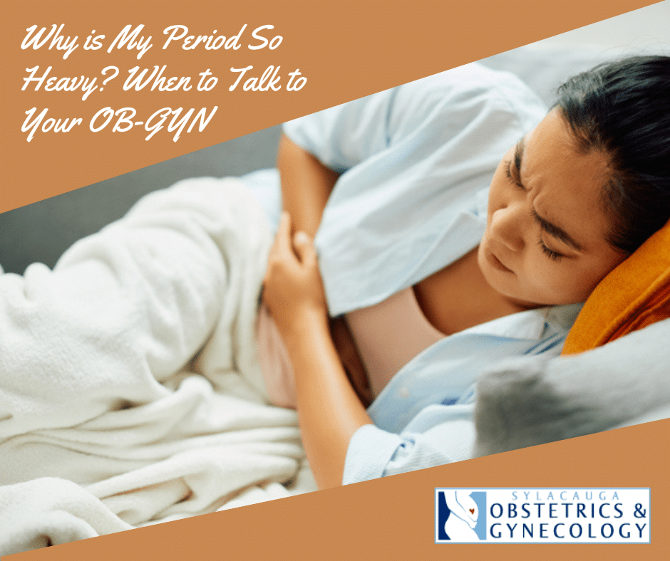 Young woman lying on couch and holding her abdomen in pain representing heavy periods