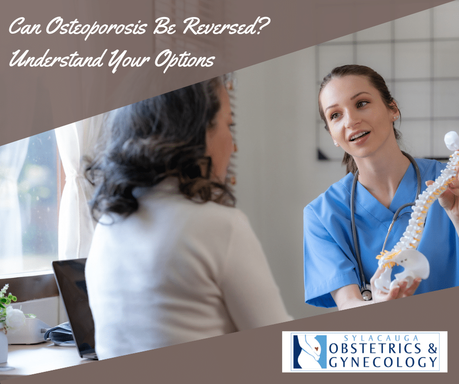 A doctor explaining osteoporosis to a patient using a model of the spine.